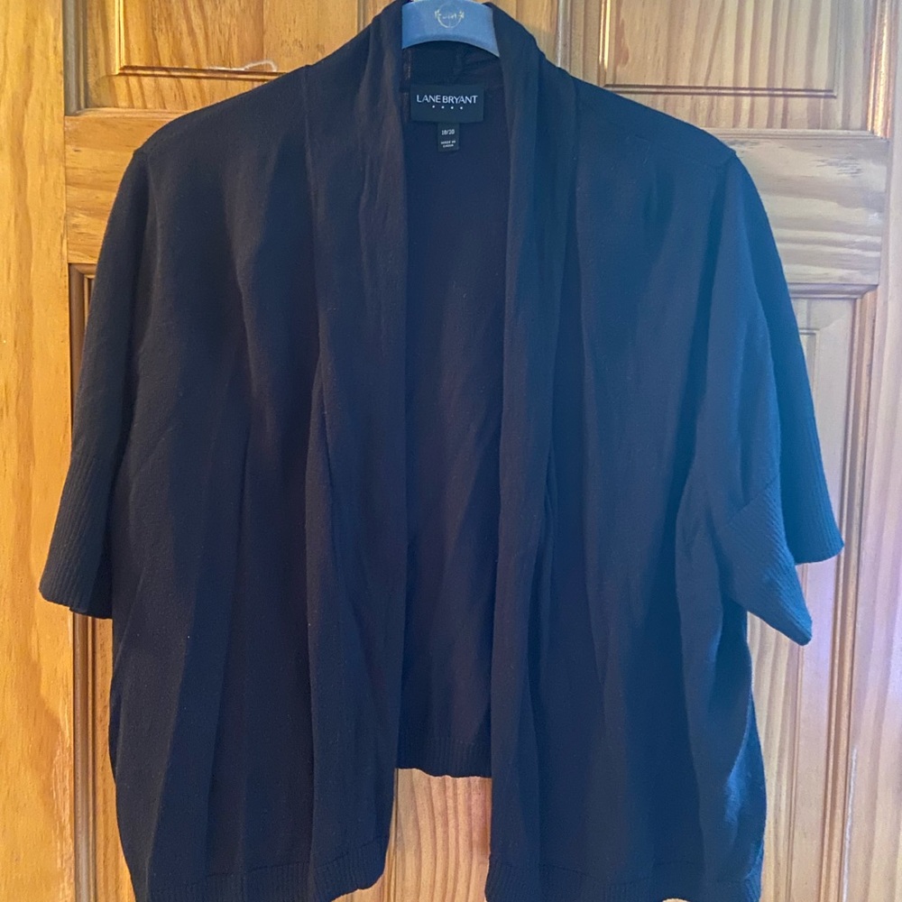 Black short sleeve cardigan.